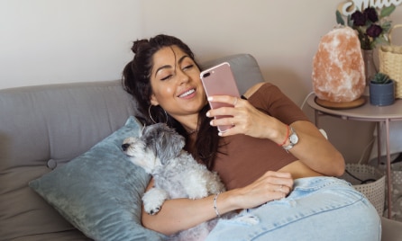 dog with owner and phone